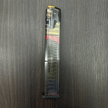 CARGADOR TRANSPARENTE EXPANSIVO PARA PISTOLAS GLOCK 17, 19, 19X, 26, 34 Y 45 DE 32 BALAS, CALIBRE 9MM